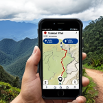 **A hiker in Doi Inthanon National Park using a Gaia GPS app on their smartphone to navigate a mountain trail. Focus on the map display and the beautiful mountain scenery in the background.**